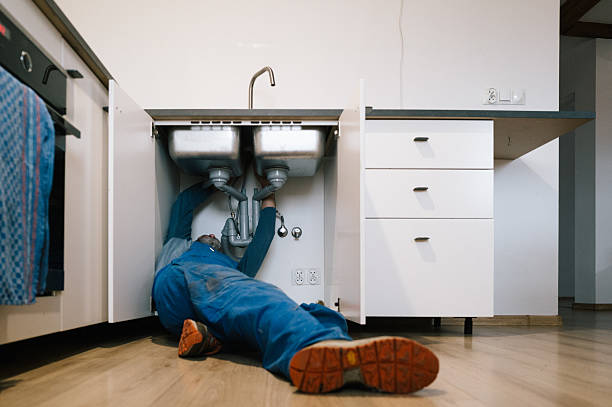 Professional Emergency Plumber technician working in Spring House, PA